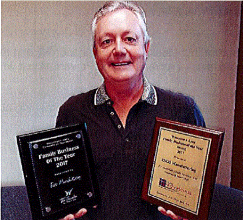 Mark Stein holding awards